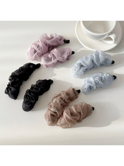 Beau tulle ruffle high ponytail claw clip displayed on a white background