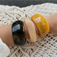 Lovra wide bangle bracelet worn on wrist showcasing its trendy irregular shape
