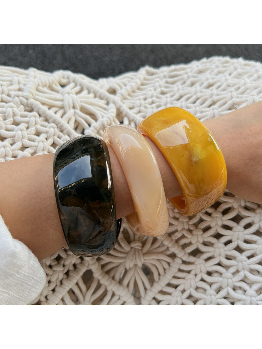 Lovra wide bangle bracelet worn on wrist showcasing its trendy irregular shape