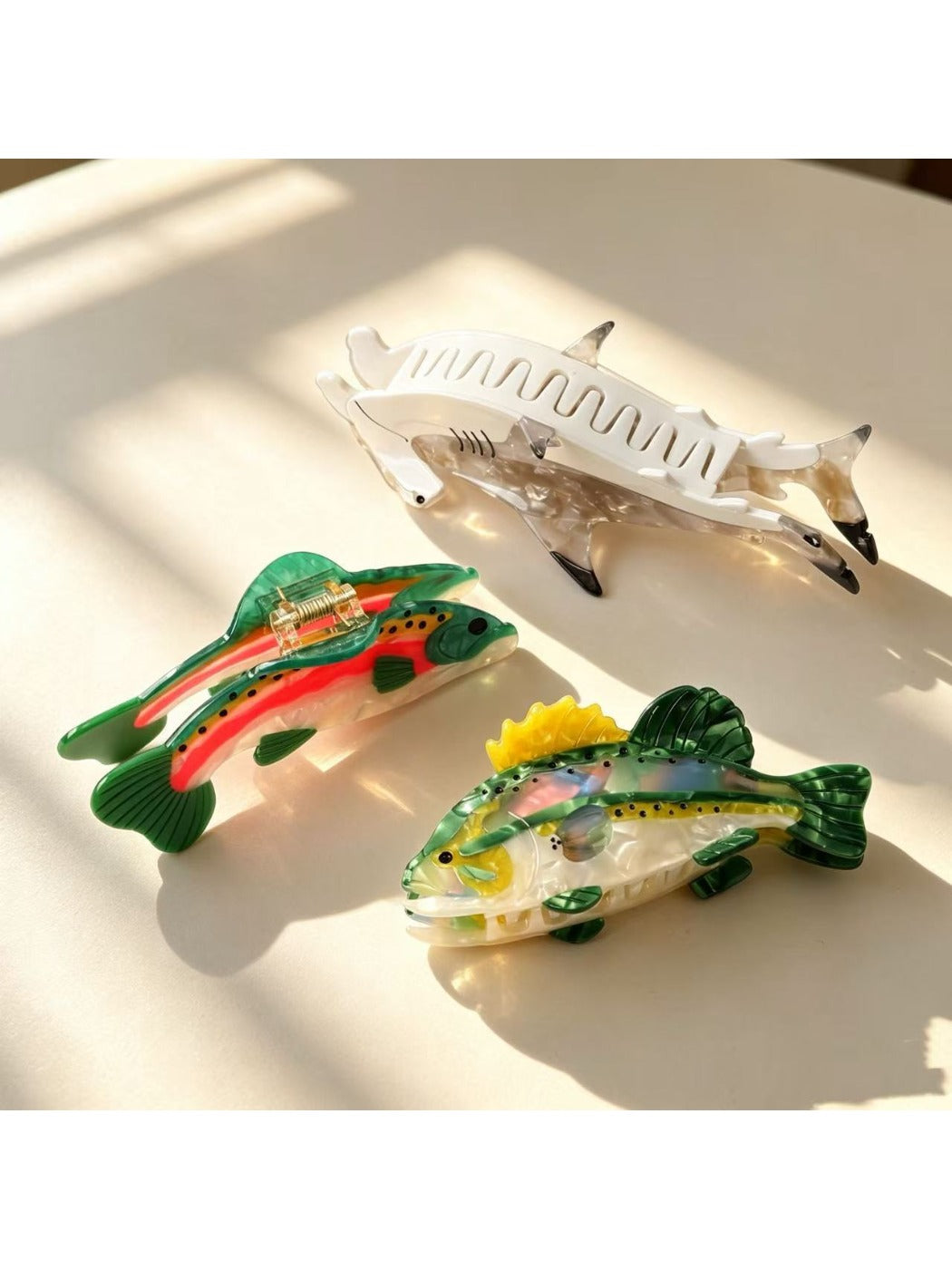 Beau fish shape claw clip held in hand to show size and grip