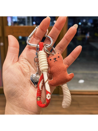 Bear keychain attached to a metal keyring with a small chain