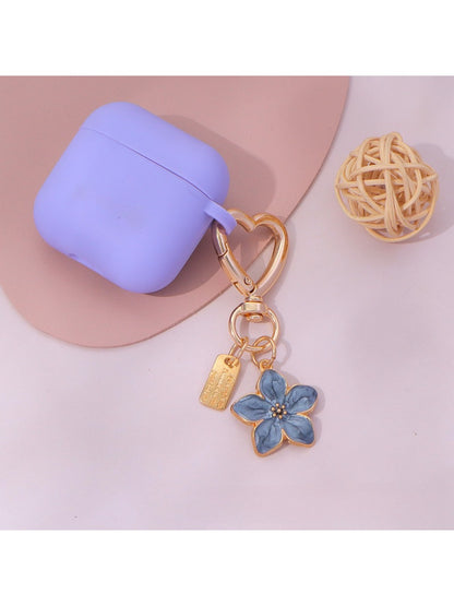 Keypus keychain with multiple floral charms in pink and white colors