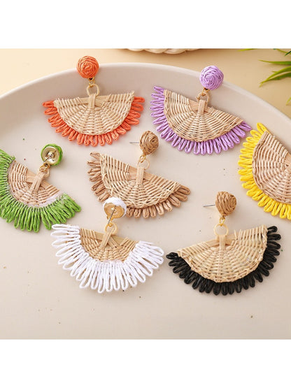 Earedge raffia fan shaped drop earrings displayed hanging on a stand