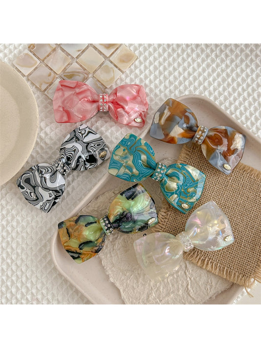 Beau - Marbled Acetate Bow Spring Hair Clip