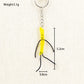 Mini French fries keychain displayed with other novelty keychains