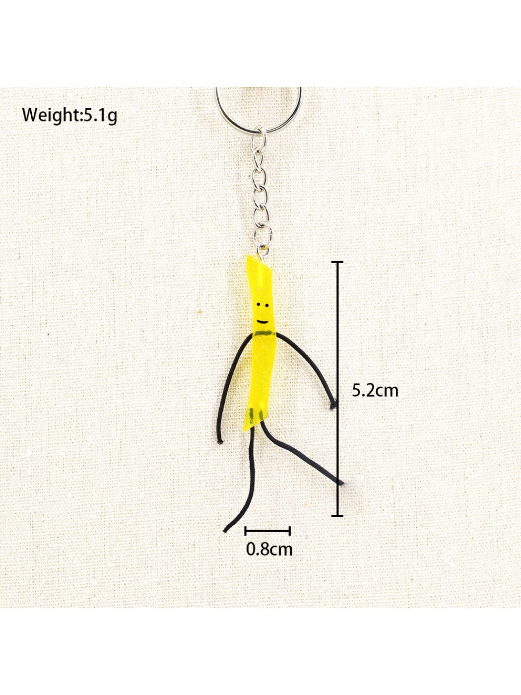 Mini French fries keychain displayed with other novelty keychains