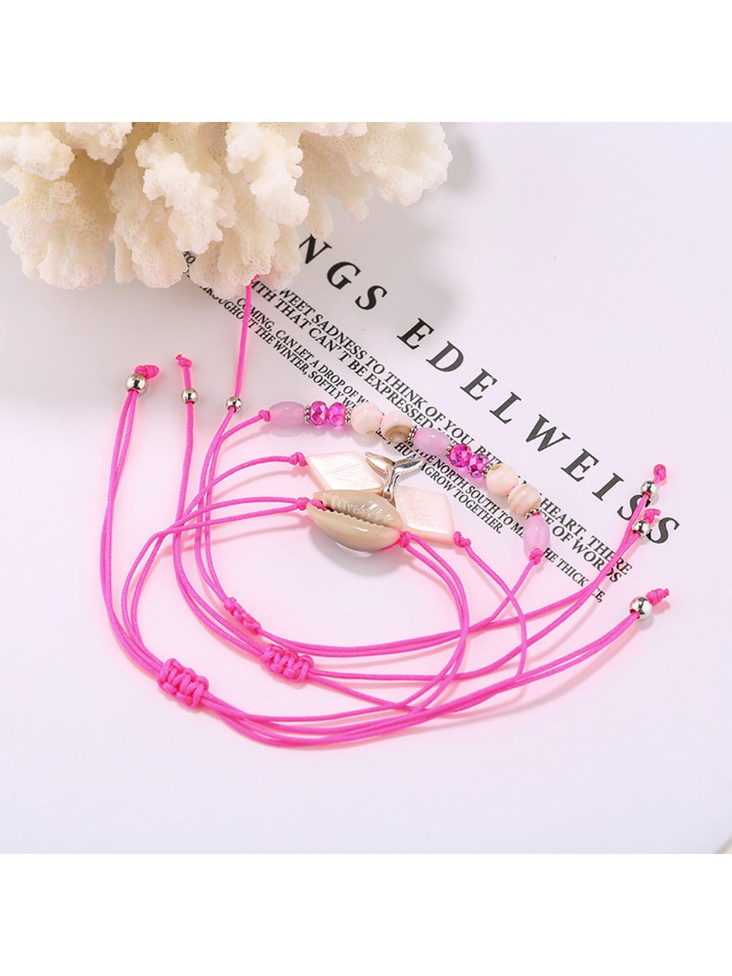 Lovra alloy mermaid tail charm bracelet displayed on a wooden surface