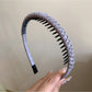 Top view of Gifty headband showing its uniform solid color