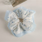 Top view of Gifty Sweet Graceful Floral Scrunchie showing floral print and elastic band