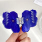 Side view of Beau flower shaped hair claw clip highlighting thickness and design