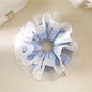 Double layer blue stripe ruffle scrunchie on a white background