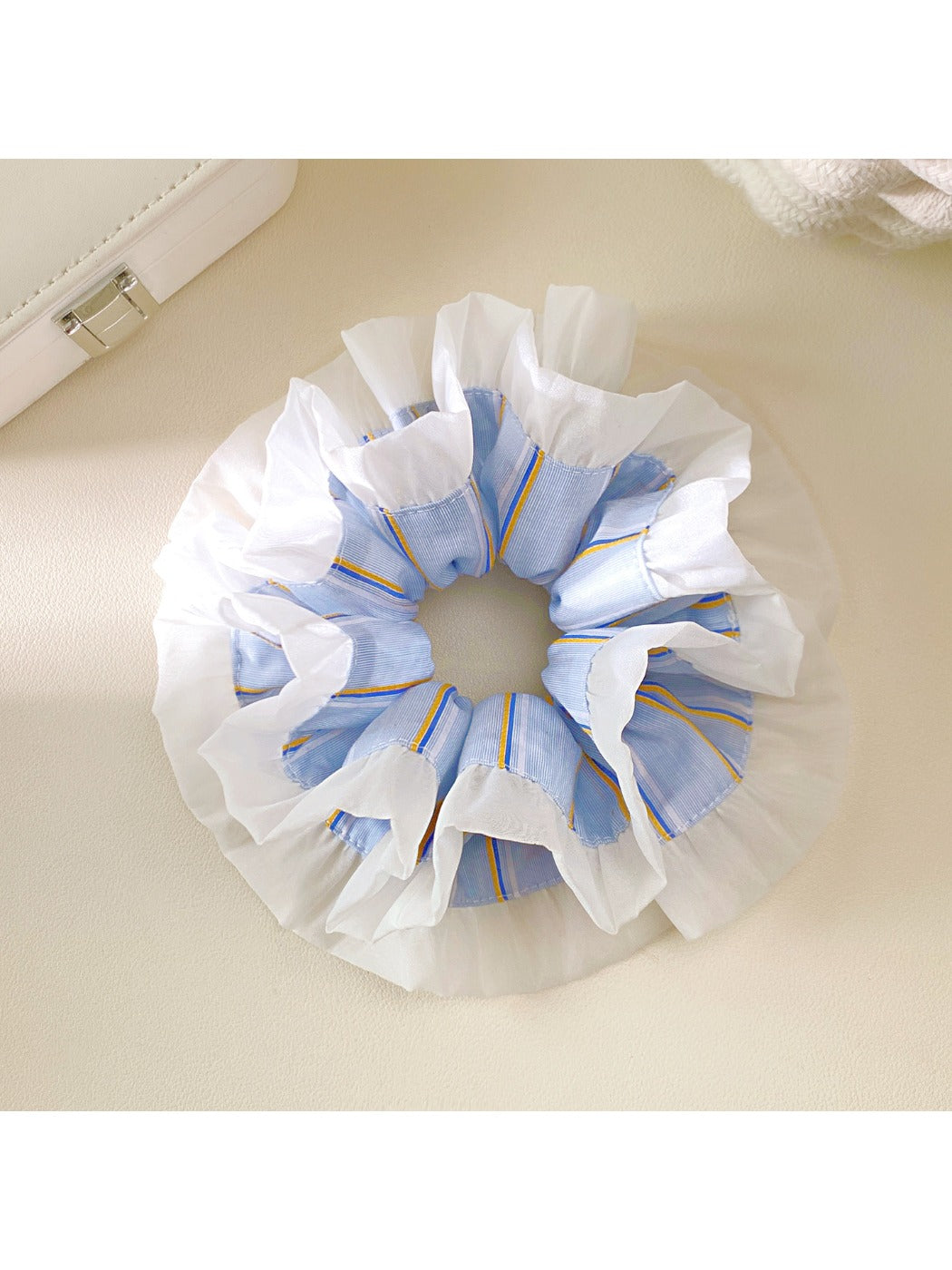 Double layer blue stripe ruffle scrunchie on a white background