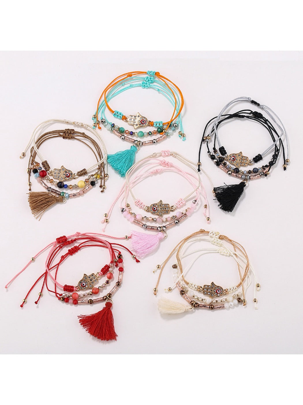 Lovra alloy charm tassel pendant bracelet on white background
