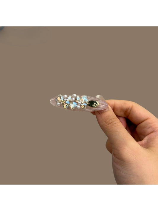 Close-up of Beau sparkly rhinestone hair clip with silver-tone metal and clear rhinestones