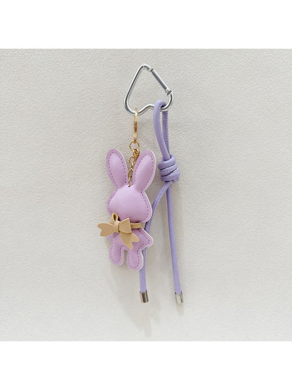 Cartoon bunny keychain with smiling expression on a keyring