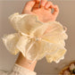 Gifty double layer tulle scrunchie worn on wrist as a bracelet
