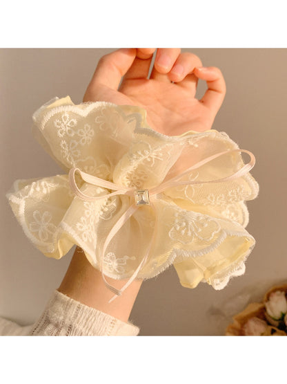Gifty double layer tulle scrunchie worn on wrist as a bracelet