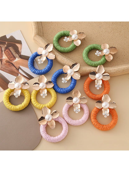 Close-up of Earedge round floral pendant earrings with intricate flower design