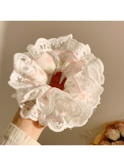 Gifty scrunchie displayed with matching accessories emphasizing sweet and charming style