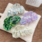 Beau delicate leaf shaped hair claw clip in light beige on white background