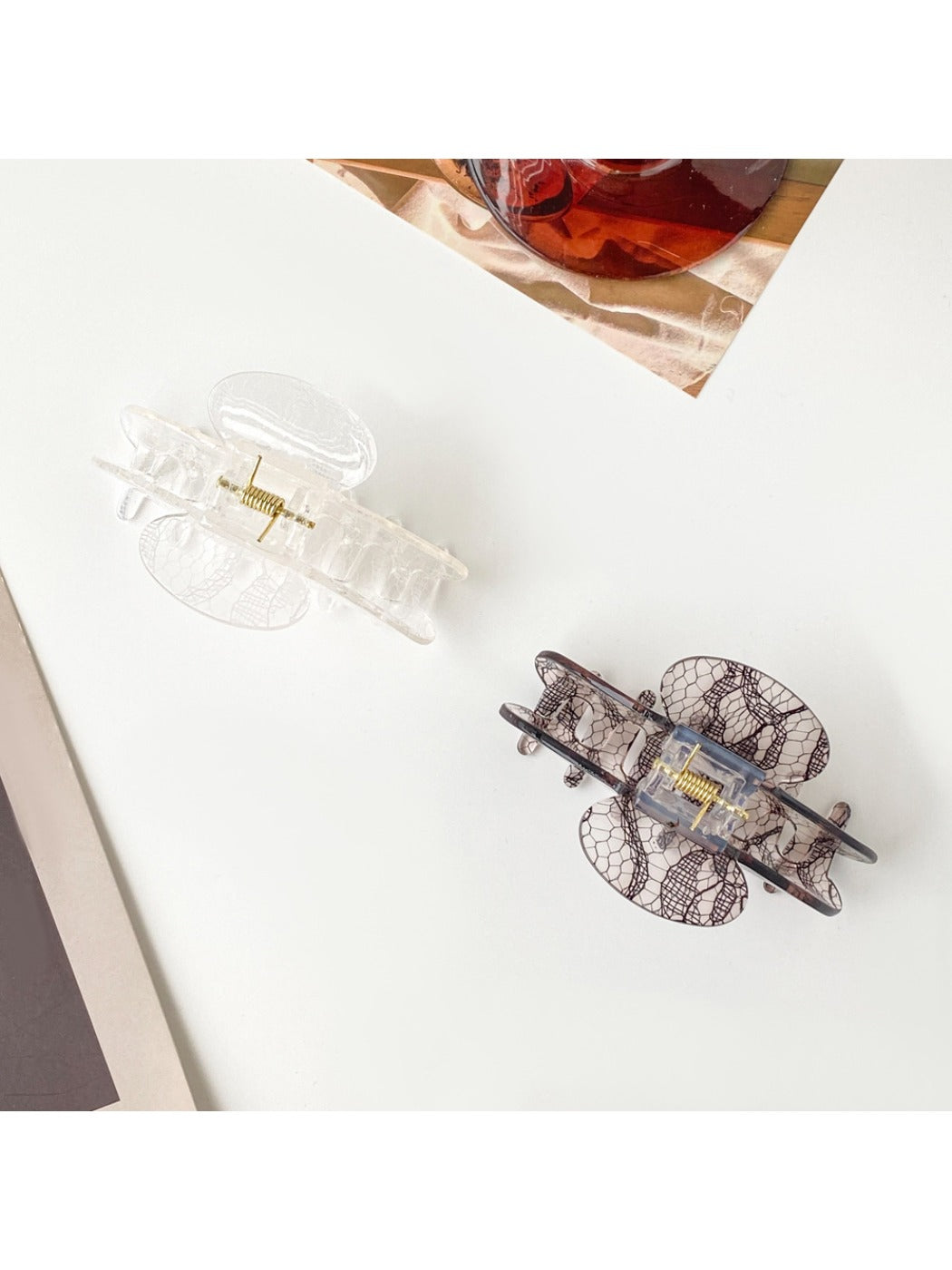 Beau Romantic Lace Vibe hair clip held in hand highlighting size and texture