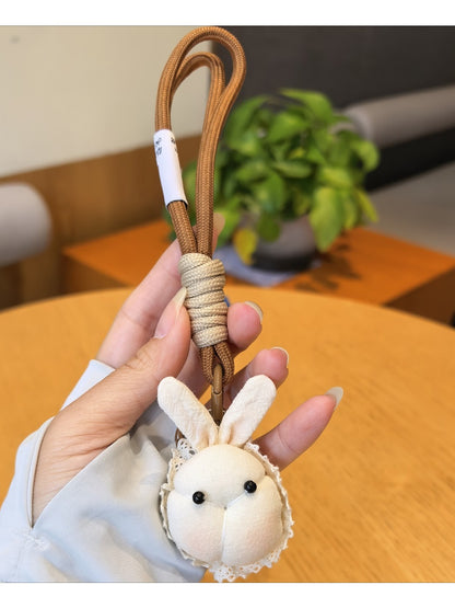 Back view of the little bunny shaped bag charm keychain in pastel pink