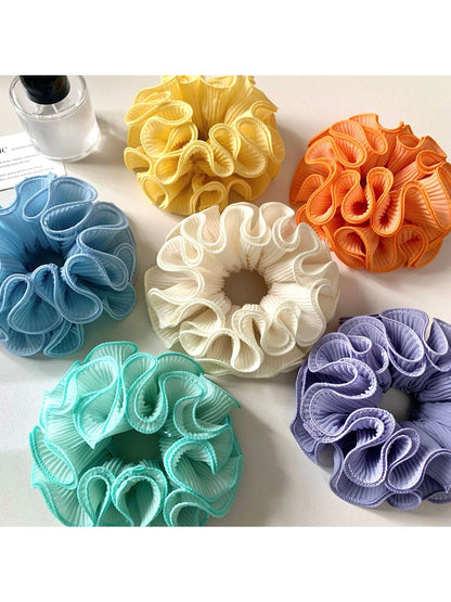 Close-up of Gifty minimalist solid color ruffle scrunchie in soft fabric