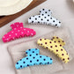 Beau polka dot half circle claw clip on white background