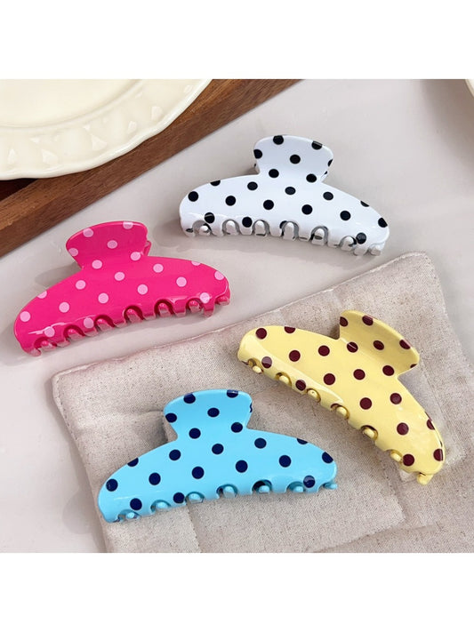 Beau polka dot half circle claw clip on white background