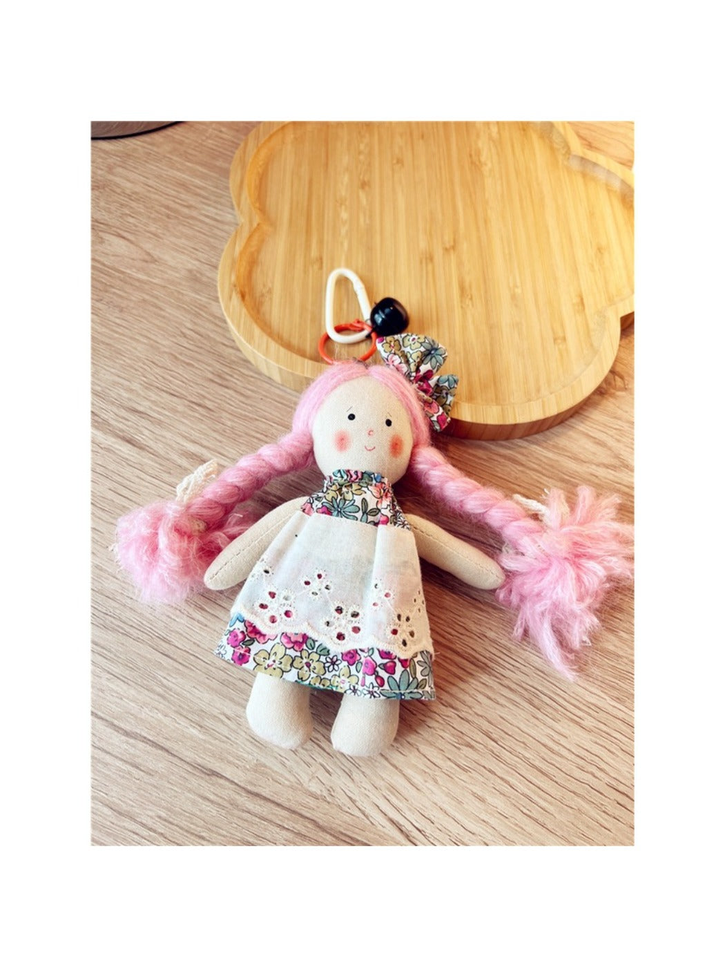 Keypus cartoon doll keychain held in hand to show size and details