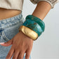 Lovra silver bracelet with irregular textured design displayed on white background