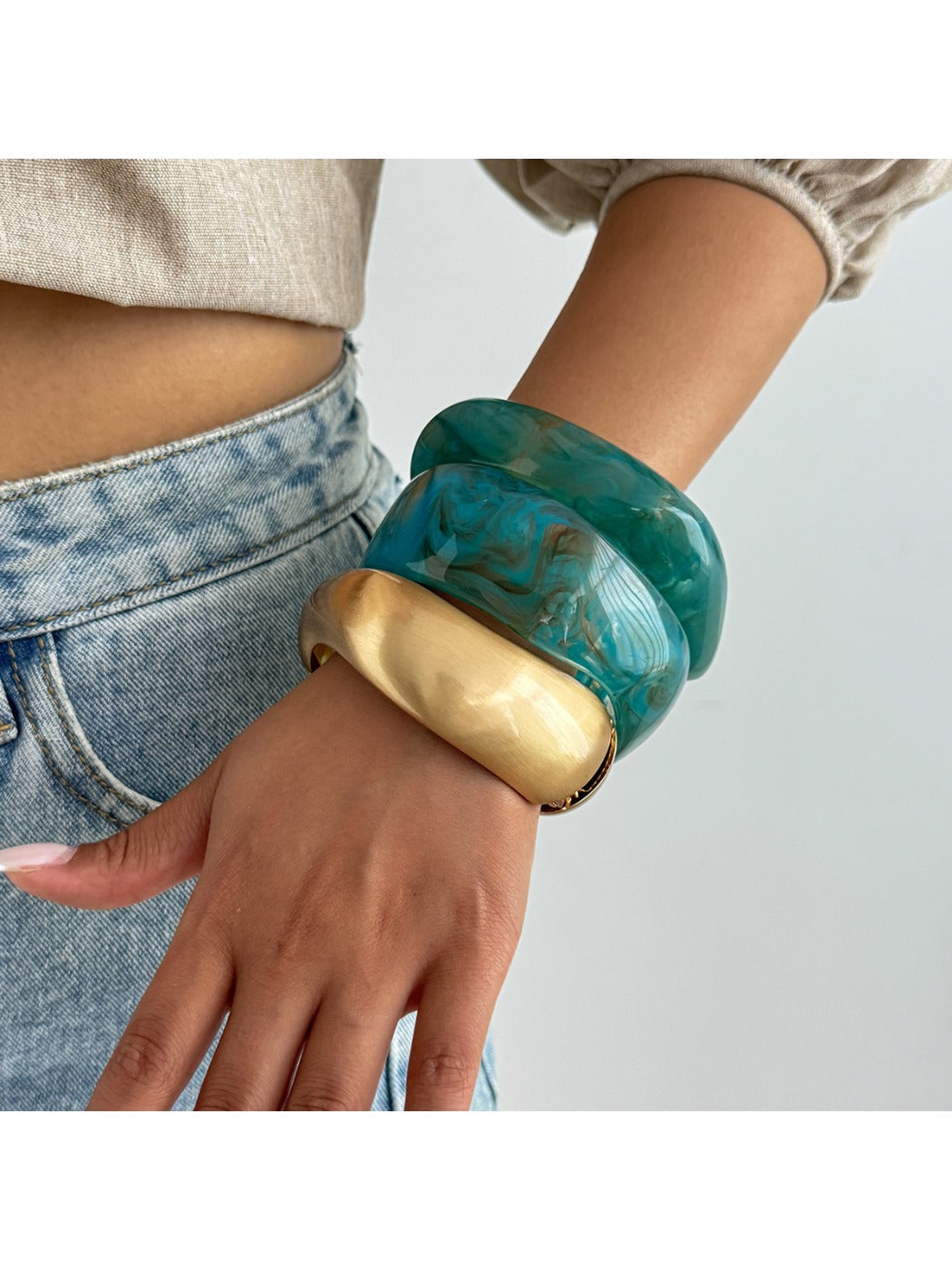 Lovra silver bracelet with irregular textured design displayed on white background