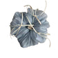 Blue tulle scrunchie with ribbon bow displayed on a wooden surface