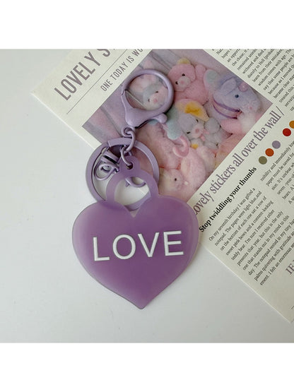 Solid color heart-shaped pendant keychain in pink with silver keyring