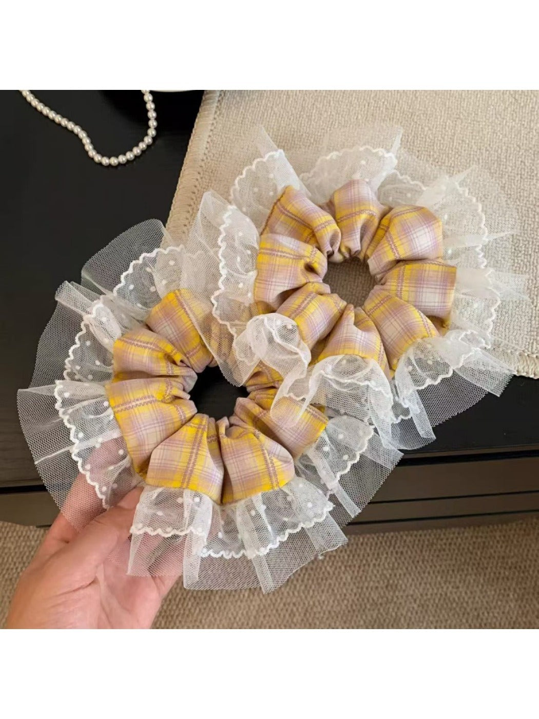 Close-up of vintage yellow plaid scrunchie fabric texture
