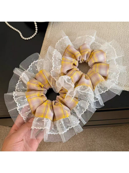 Close-up of vintage yellow plaid scrunchie fabric texture