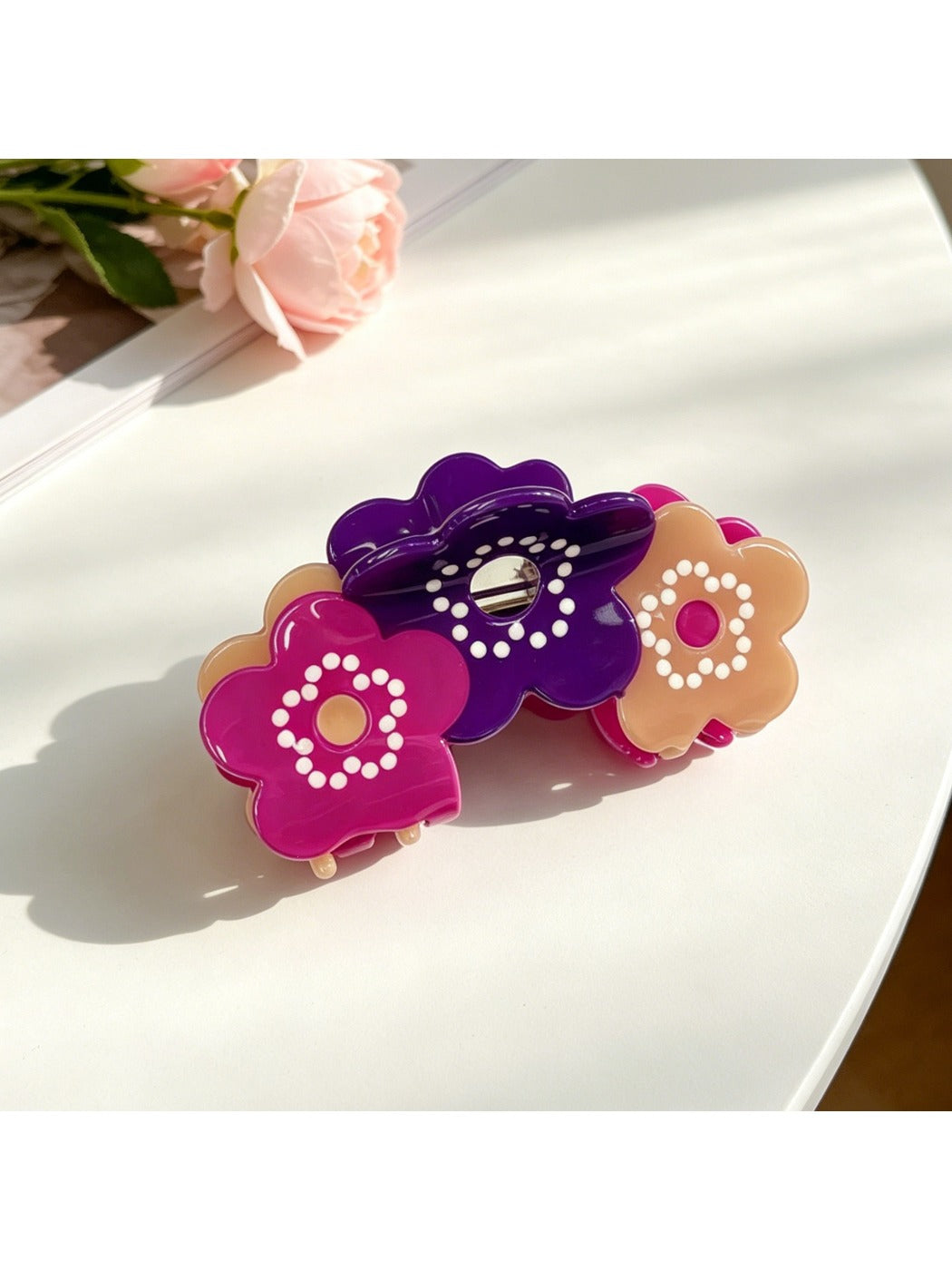 Beau hair clip styled in dark hair highlighting its elegant design and shine