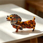 Close-up of Beau cartoon dachshund claw clip dog face with black nose and eyes