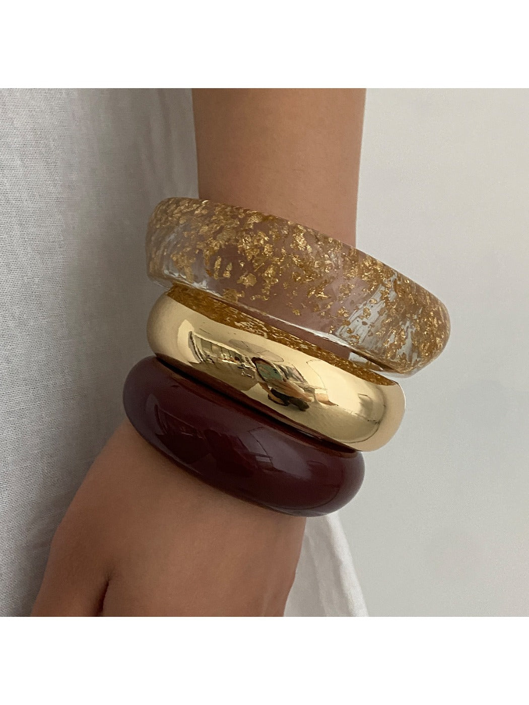 Close-up of Lovra stackable bracelet showing polished surface and clasp detail