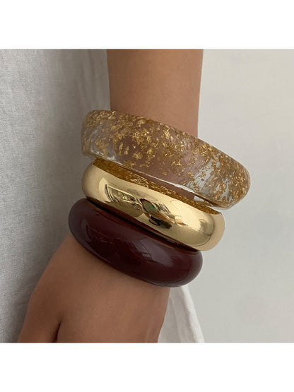 Close-up of Lovra stackable bracelet showing polished surface and clasp detail