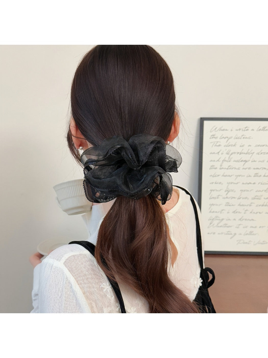 Side view of Gifty minimalist scrunchie highlighting the ruched design and fabric folds