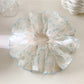 Gifty scrunchie packaged in branded box with clear window