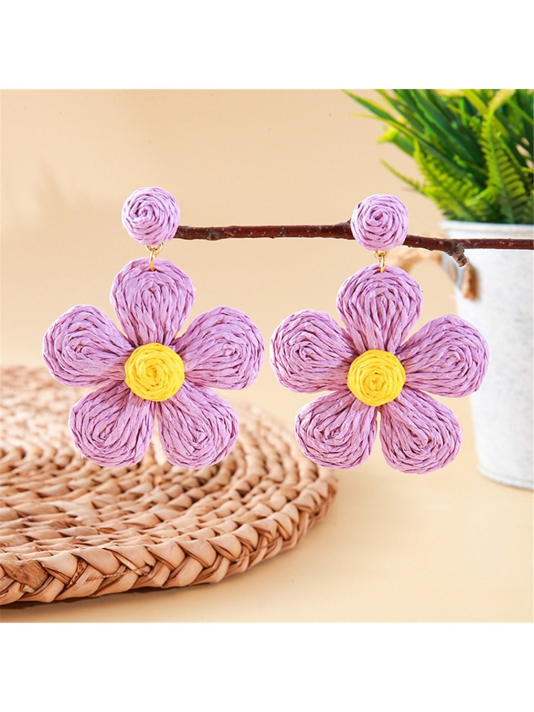Earedge knitted flower earrings in multiple colors arranged in a circle
