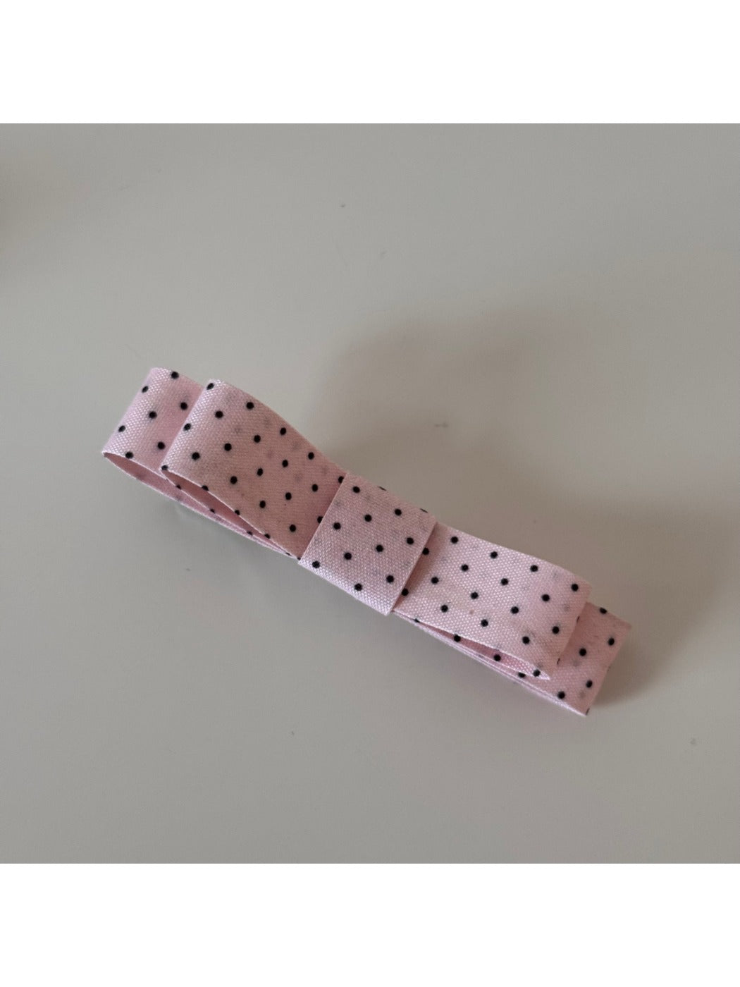 Beau hair clip showing detailed floral pattern and smooth finish