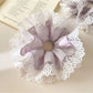 Top view of Gifty scrunchie showing gathered fabric and lace detail