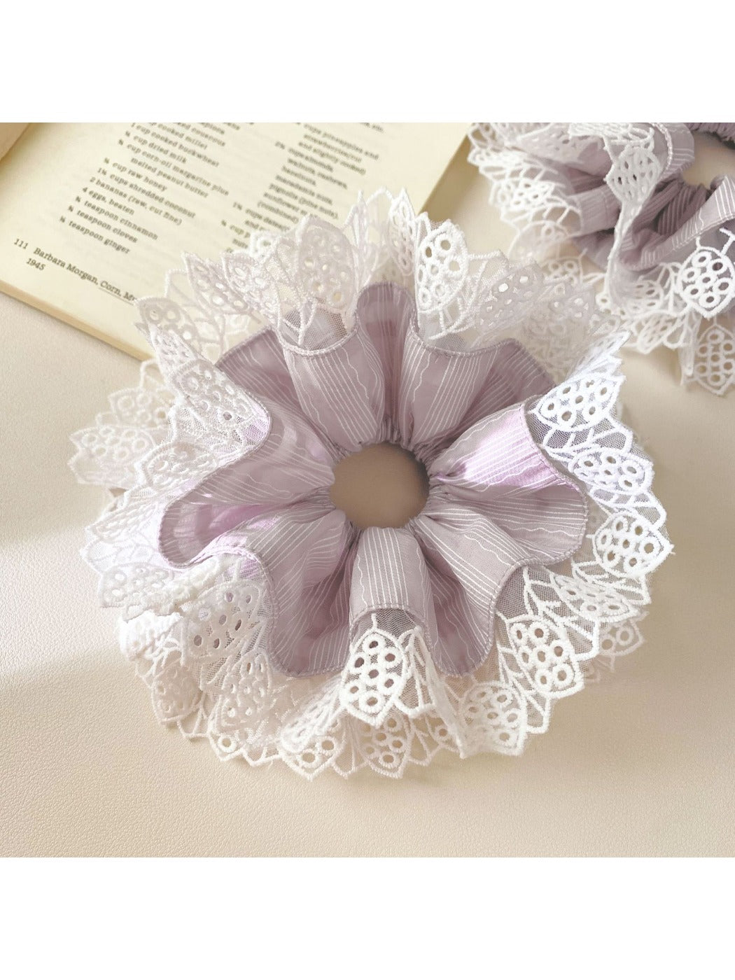 Top view of Gifty scrunchie showing gathered fabric and lace detail