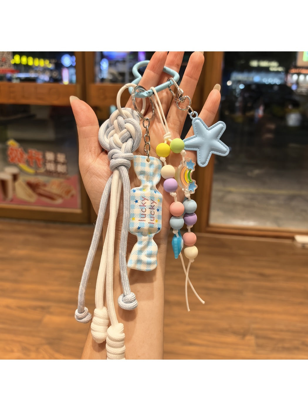 Close-up of blue star candy keychain showing glossy texture and silver ring