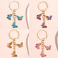 Color block butterfly shaped keychain with vibrant pastel colors on a white background