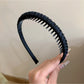Gifty solid color headband styled with loose waves on a model