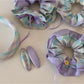 Close-up of Gifty checkered bow ribbon scrunchie fabric texture